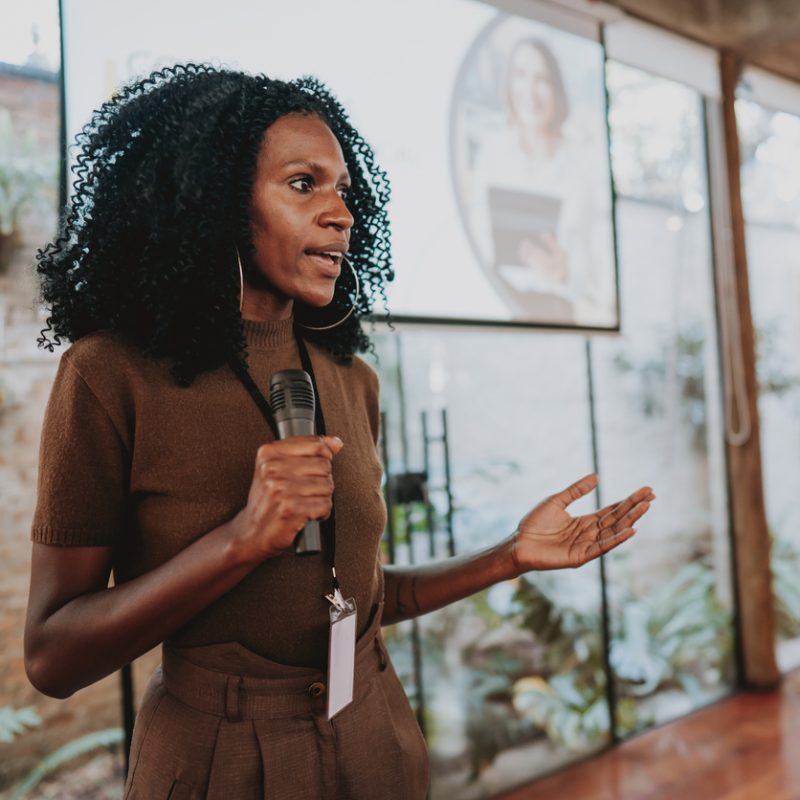 Woman giving speaker presentation